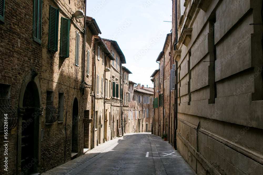Narrow street of an Italian medieval village, typical of Tuscany and Umbria