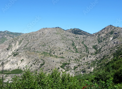 Area north of Mount St. Helens and Spirit Lake 35 years after eruption. The successive landslide into Spirit Lake caused a huge wave from left, sweeping the mountain and leaving it completely bared.