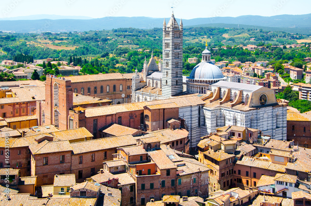 Metropolitan Cathedral of Saint Mary of the Assumption in Siena, aka Duomo di Siena, Tuscany region, Italy, Europe. Aerial view from Torre del Mangia.