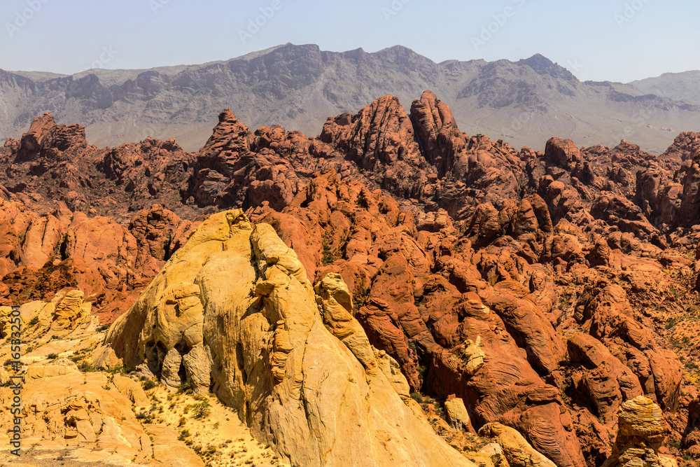 Valley of Fire State Park with 40,000 acres of bright red Aztec sandstone outcrops nestled in gray and tan limestone V