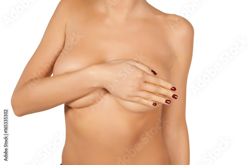 Nude woman covering her breast