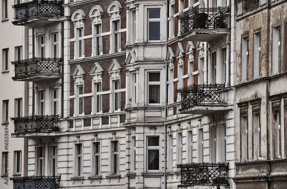 Windows and balconies building in downtown city of Poznan in Poland.