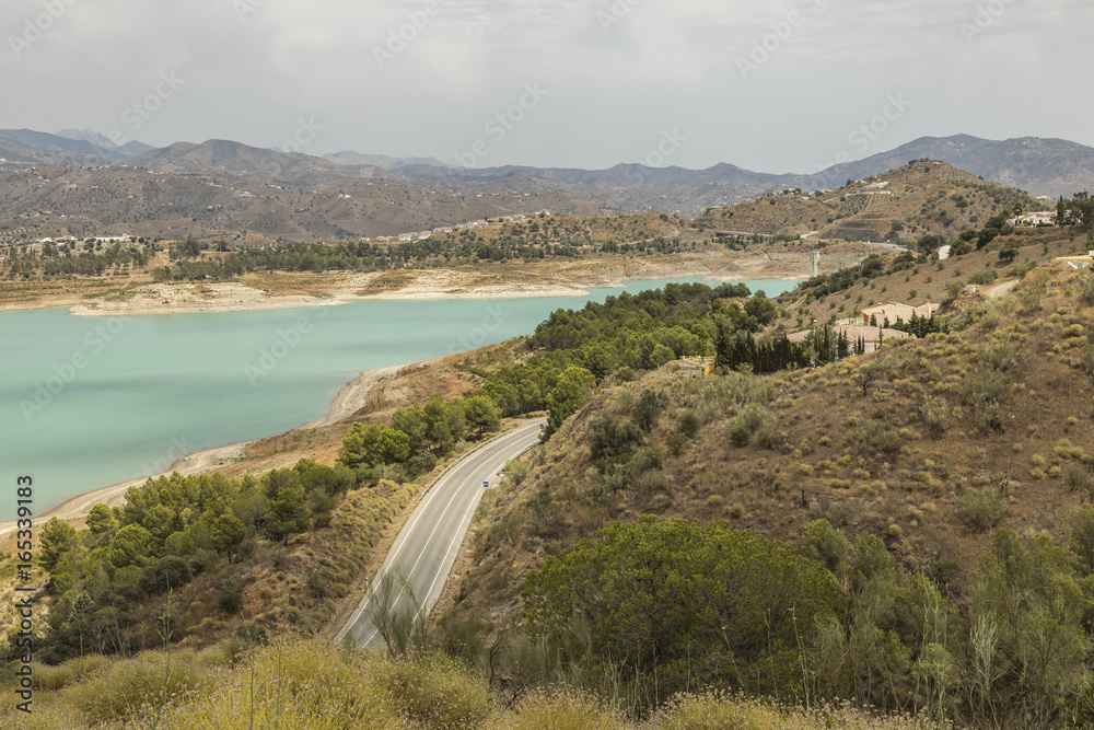 Road To Lake Vinuela / An image of Lake Vinuela and the surrounding countryside that includes the Sierra Tejada mountain range shot in Andalusia, Spain.