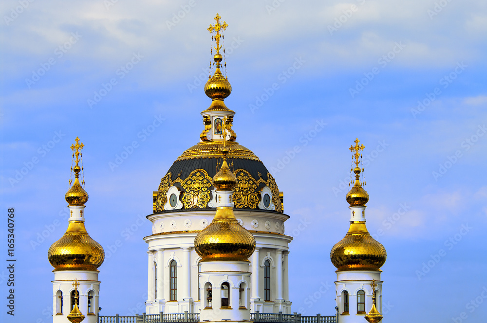 The Golden domes of the Russian Orthodox Church close-up. The Church of saints Peter and Fevronia. Donetsk.