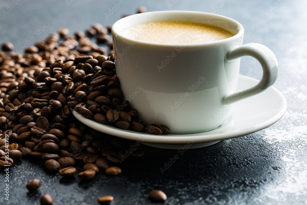 Hot coffee cappuccino and coffee beans. Hot coffee cappuccino and coffee beans.