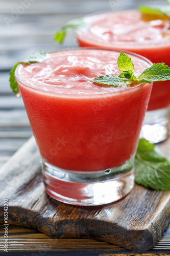 Watermelon smoothie and mint leaves.