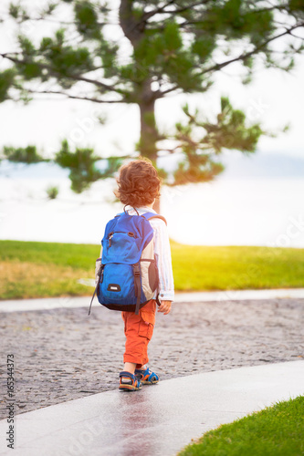 A boy with a backpack.