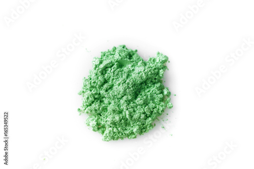 Crushed green eye shadow isolated on white background