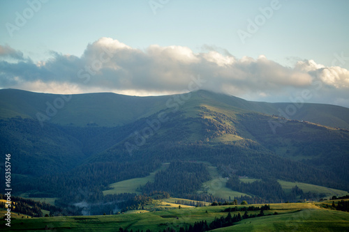 Storm clouds over mountains and the forest