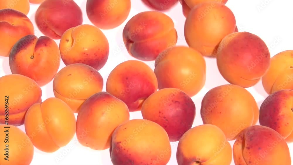 Apricot. Ripe Organic Apricots are rolling on the table. Slow motion 240 fps. Full HD 1080p. 