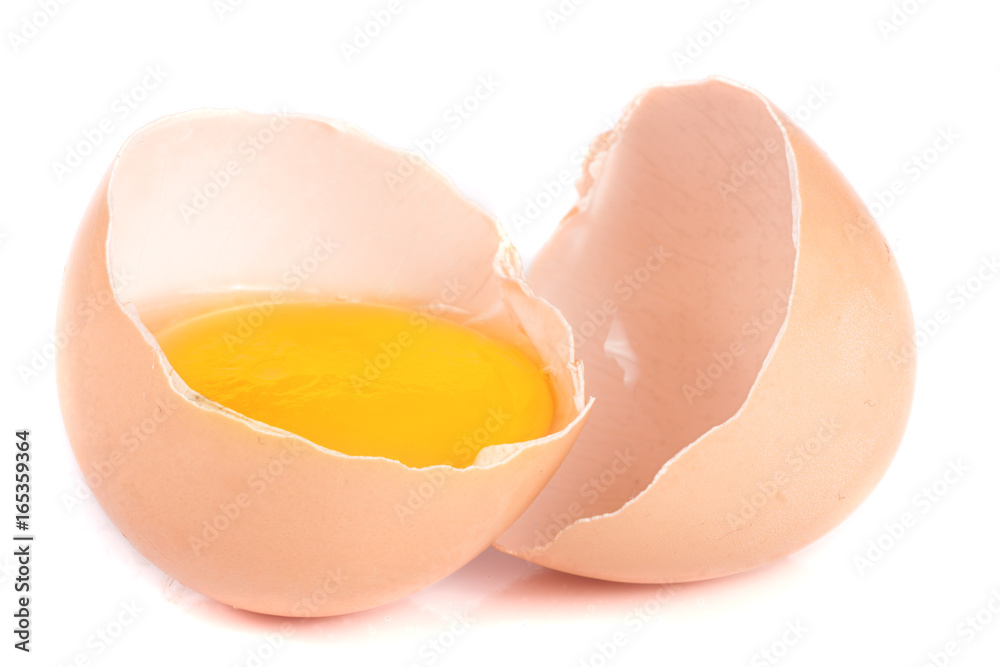 Broken egg with yolk and eggshell isolated on white background