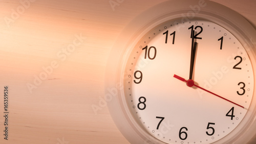 Clock ticking showing twelve hours