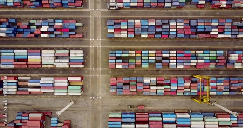 JAKARTA, Indonesia. July 10, 2017: Top view footage of containers terminal with crane and truck in Tanjung Priok harbor. Shot in 4k resolution photo