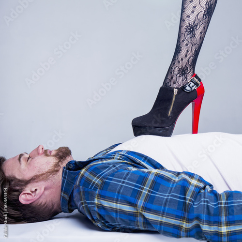 Foto Gender inequality. Domination of a woman over a man