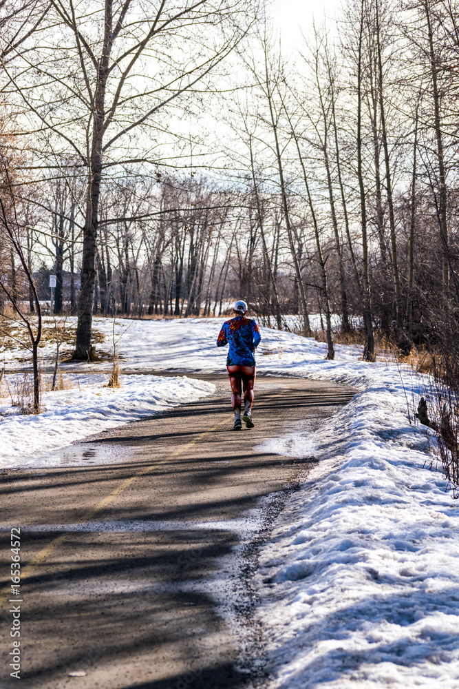 colorful female runner in a winter scene