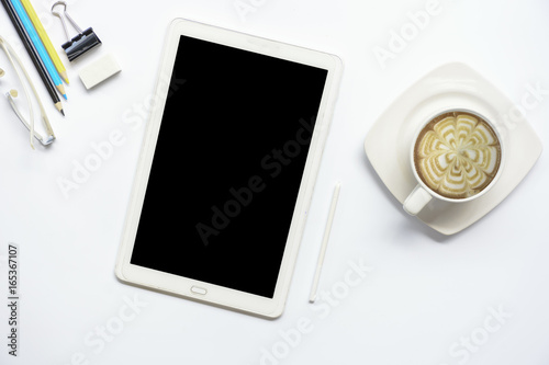 Tablet computer with coffee and equipment office on isolated.Top view and zoom in