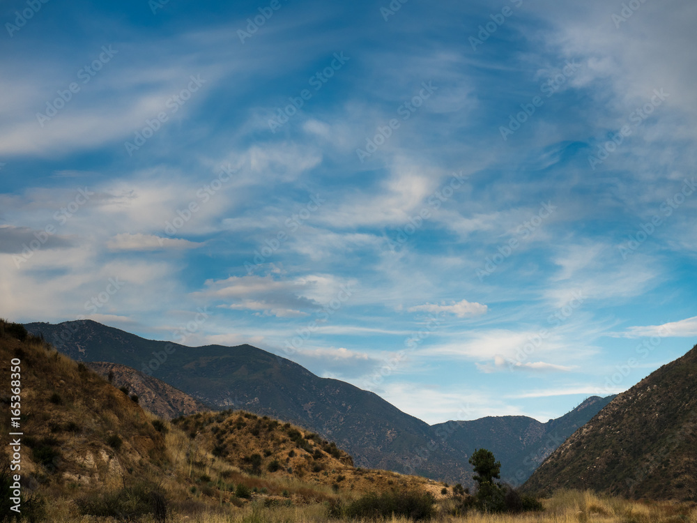 Cloudy sunset over a valley