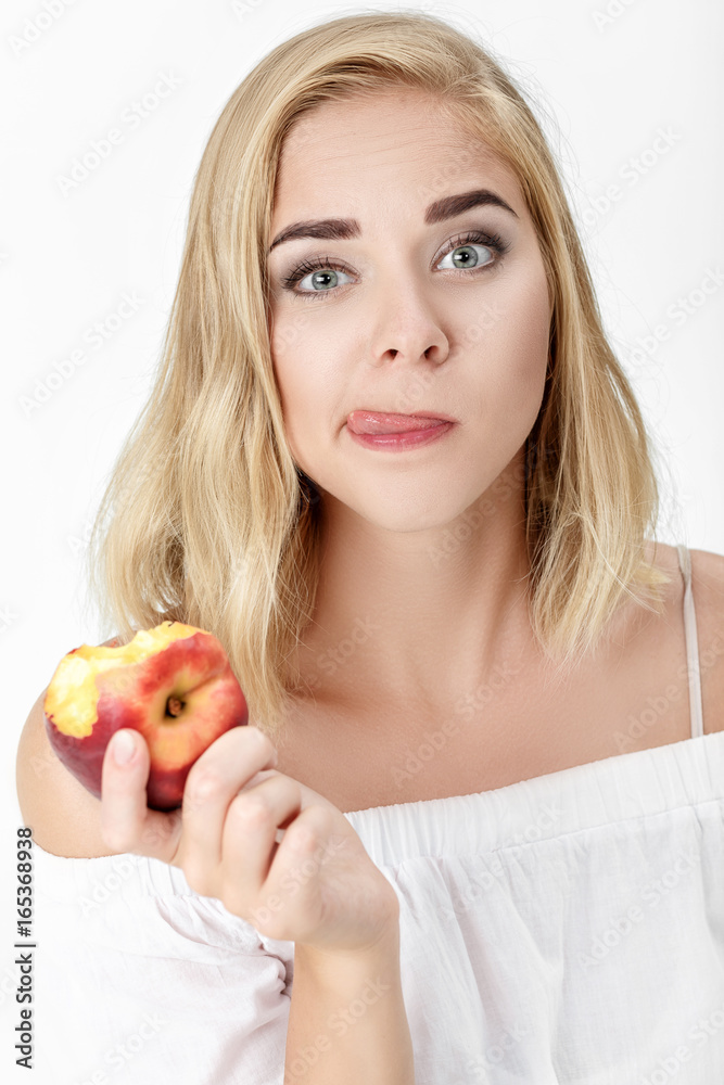 Beautiful blond woman with pleasure eating nectarine Beautiful blond woman with pleasure eating nectarine