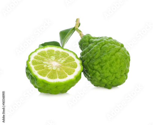 A half and a whole bergamot fruit with leaf isolated on white background.