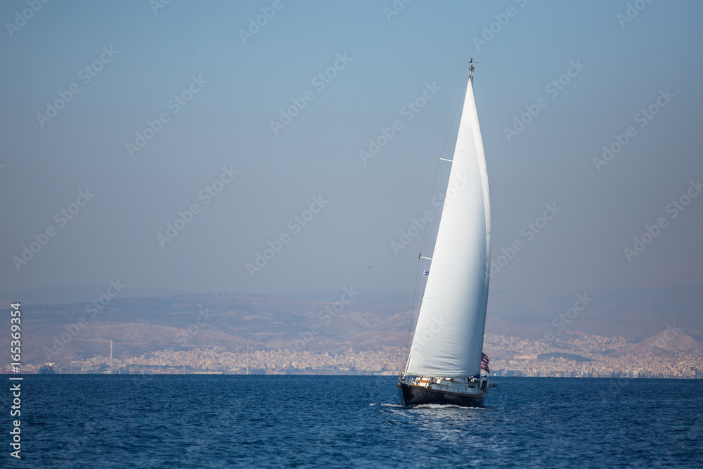 Sailing ship luxury yacht with white sails in the Sea.