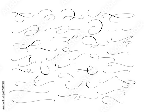 Set of custom decorative swashes and swirls, white on black. Great for wedding invitations, cards, banners, page decoration. photo