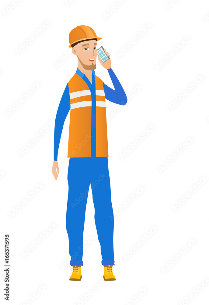 Young caucasian builder talking on a mobile phone.