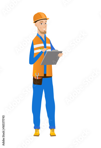 Young caucasian building inspector with clipboard.