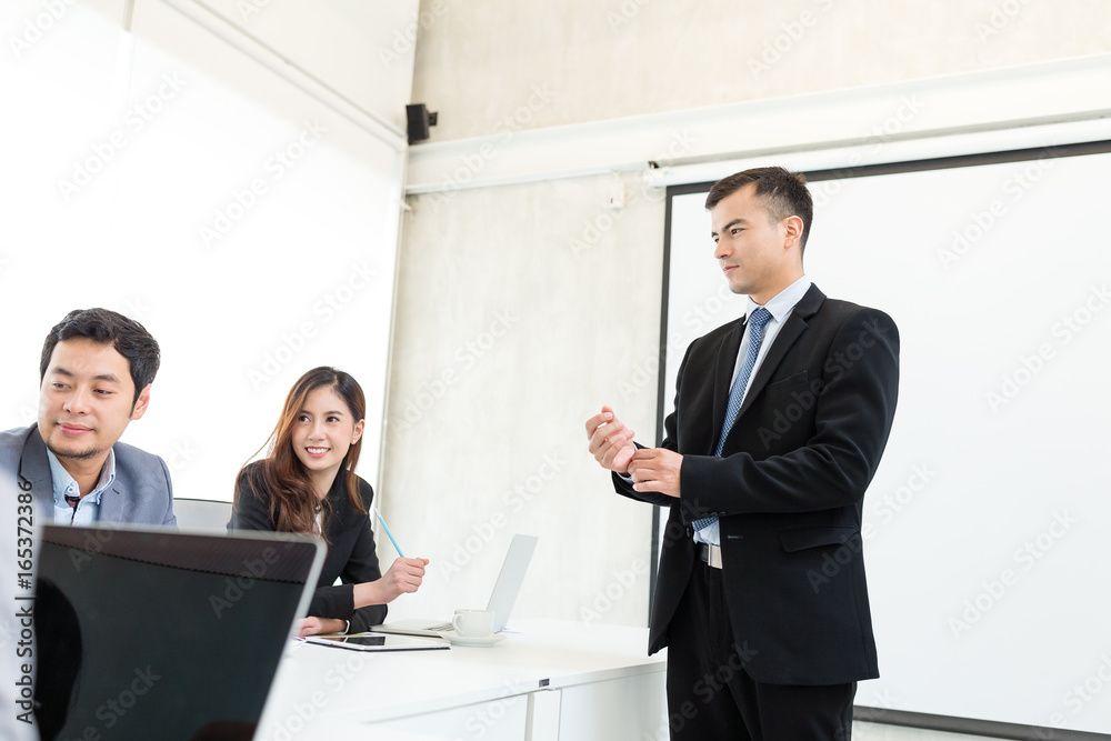 Group of business people discuss in office Group of business people discuss in office