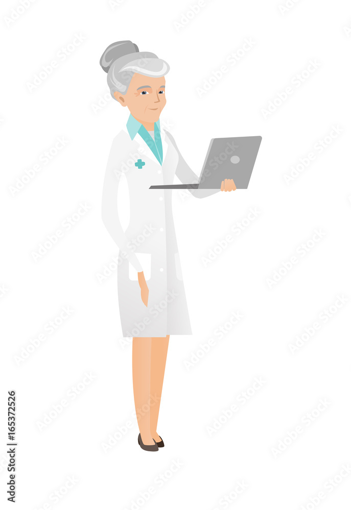 Senior caucasian doctor using a laptop.
