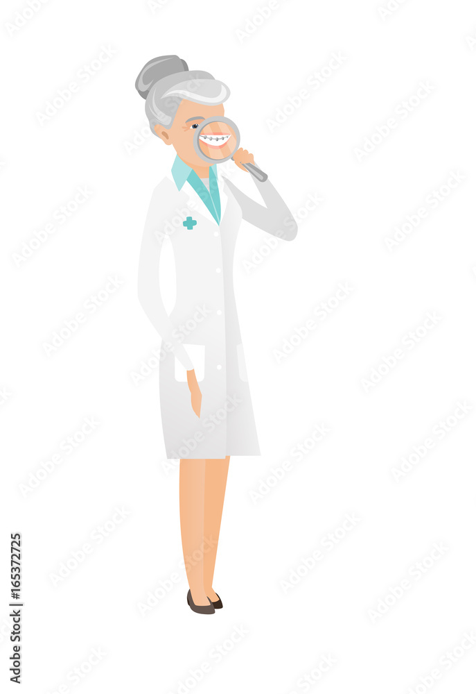 Caucasian dentist examining teeth with a magnifier Caucasian dentist examining teeth with a magnifier