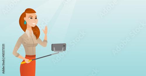 Young caucasian hipster man making selfie.