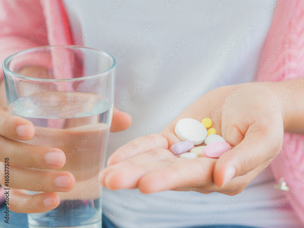 medicine, health care and people concept - close up of woman taking in pill medicine, health care and people concept - close up of woman taking in pill