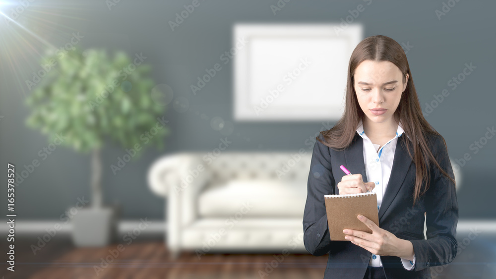 Young beautiful business woman and creative designer standing over blured interior background Young beautiful business woman and creative designer standing over blured interior background
