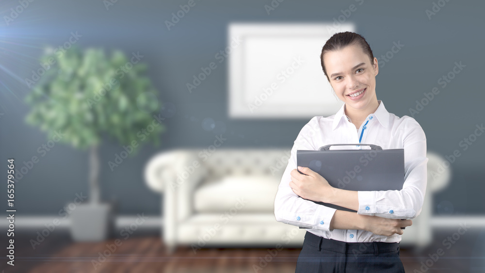 Young beautiful business woman and creative designer standing over blured interior background Young beautiful business woman and creative designer standing over blured interior background