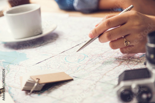 Travel planning - map with note  pen and camera photo