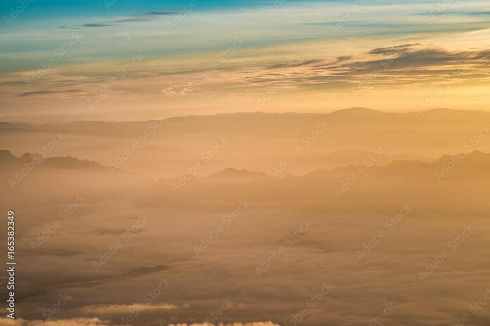 sunrise on mountain with sea of clouds