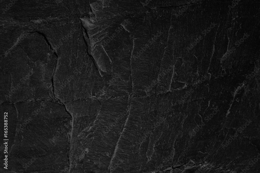 Naklejka premium Dark grey black slate background or natural stone texture.