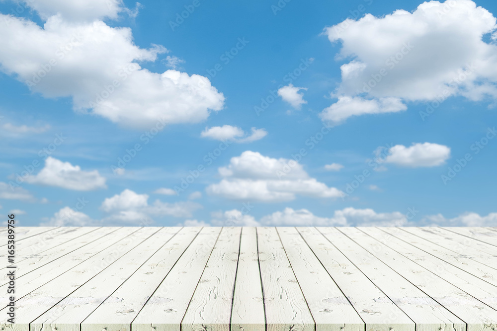 Perspective white wooden table on top over blur Blue sky and cloud ...