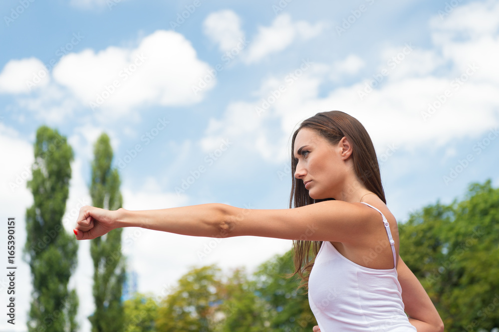 woman punching at workout sunny outdoor woman punching at workout sunny outdoor