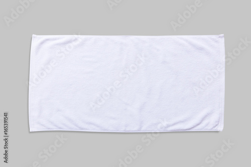White beach towel mock up isolated with clipping path on grey background, flat lay top view photo