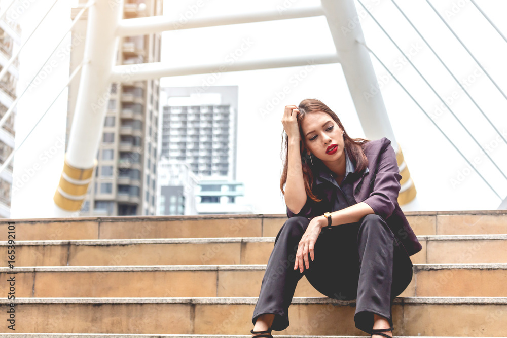 Fototapeta premium Unemployed businesswoman sit on stair