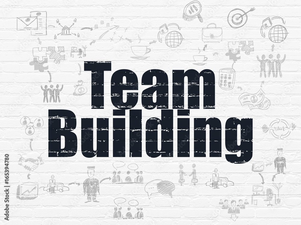 Finance concept: Team Building on wall background Finance concept: Team Building on wall background