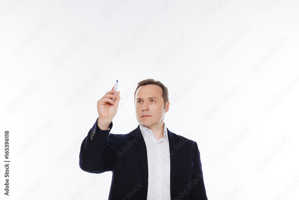 Classy devoted man pretending writing something Classy devoted man pretending writing something