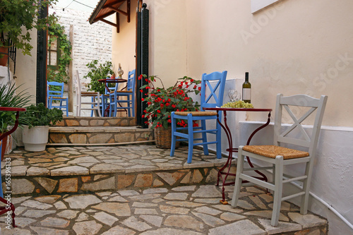 Wine and grapes on the table Parga Greece © goce risteski