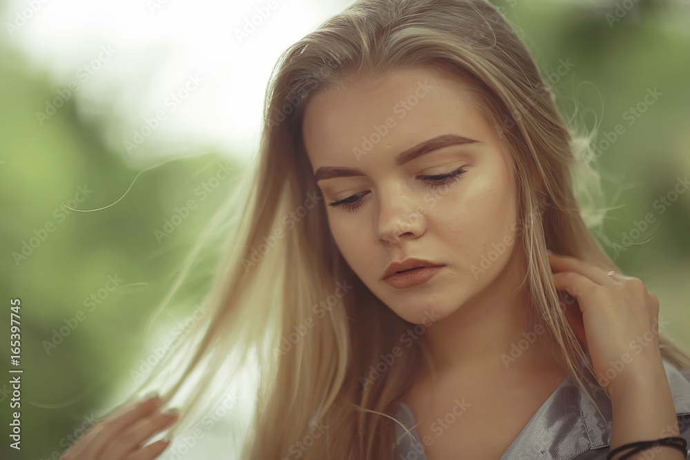 Summer beautiful young blonde in the park Summer beautiful young blonde in the park