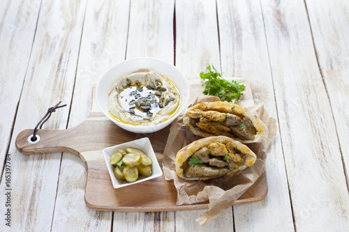 Jerusalem mixed grill or Meorav Yerushalmi. Grilled meat dish. It consists of chicken hearts, spleens and liver mixed with bits of lamb cooked on a flat grill. Israeli cuisine.  photo