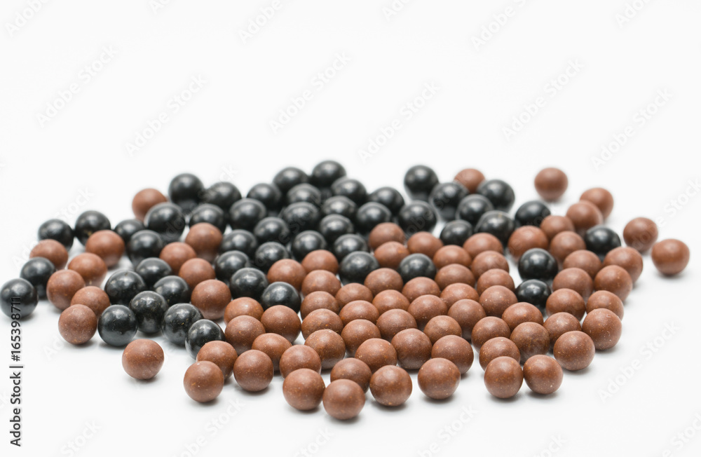 Thai herbal medicine pills spread on white background, bolus Thai herbal medicine pills spread on white background, bolus