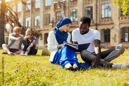 Open minded intelligent students supporting each other