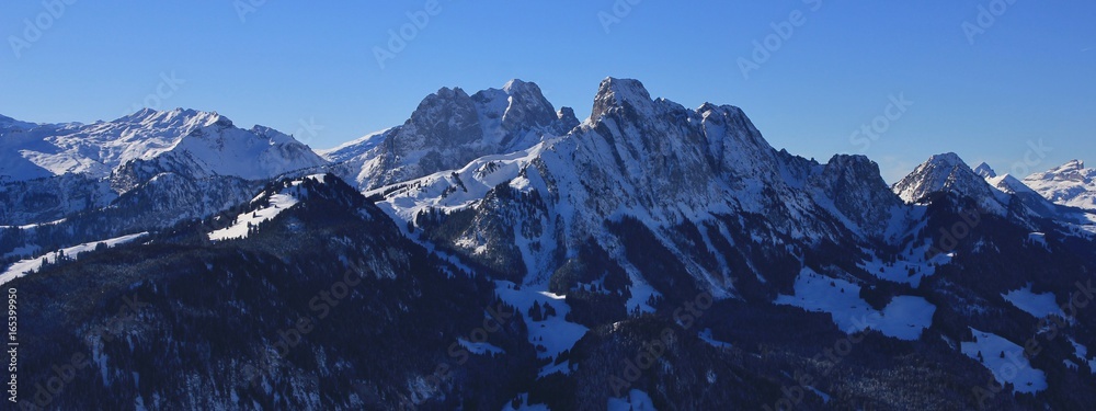 Gummfuh, Le Rubli and other mountains seen from mount Rellerli, Switzerland. Winter scene.
