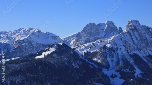 Snow covered mountains Gummfluh and Le Rubli, view from mount Rellerli.